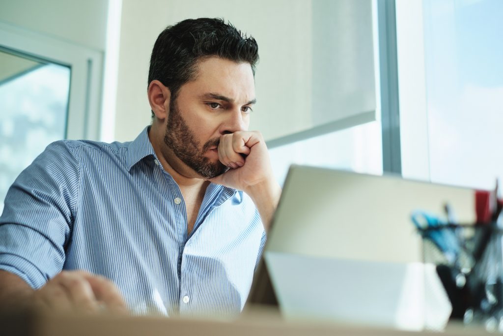 Worried man at computer