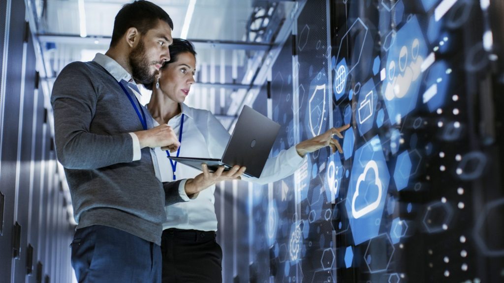 IT Support staff in a data centre looking at cloud options