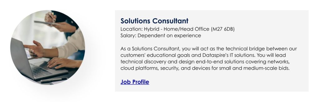 Solutions Consultant vacany ad. With hands of 2 colleagues at a laptop showing co-working.