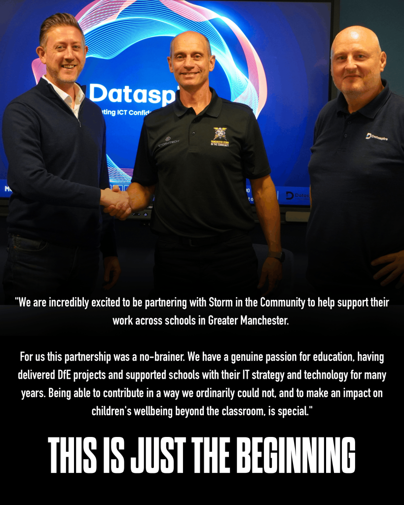 Representatives from Dataspire and Storm in the Community shaking hands on the partnership